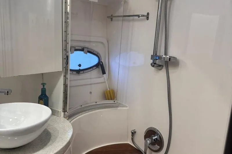 Slide: The Image of Bathroom interior of 2016 Regal 46 Sport Coupe yacht with shower and sink. - 37