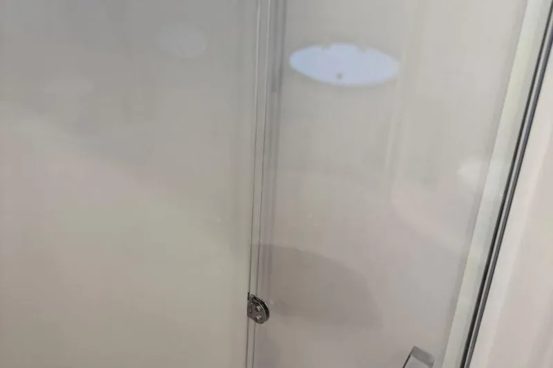 Slide: The Image of Frosted glass door detail on 2016 Regal 46 Sport Coupe yacht. - 38