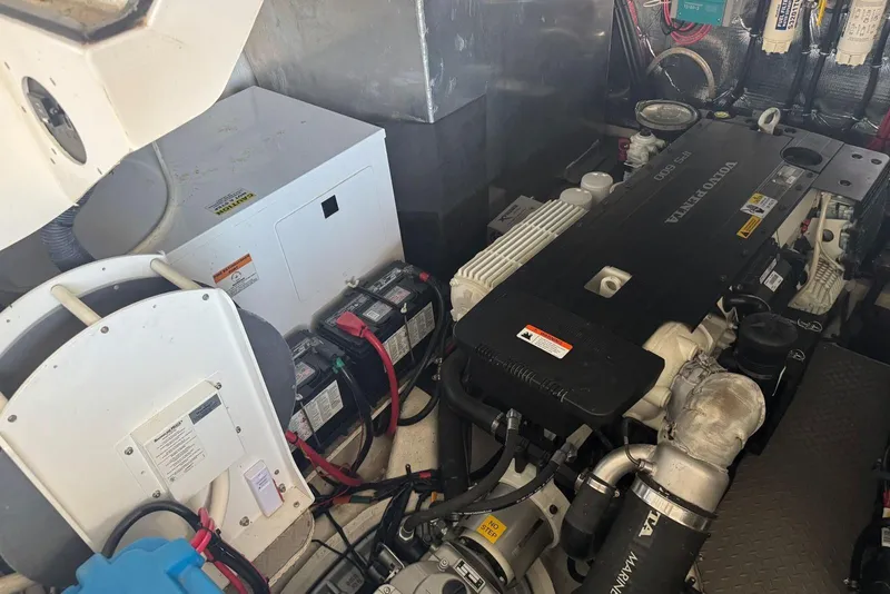 Slide: The Image of Engine room of 2016 Regal 46 Sport Coupe with Volvo Penta engine and batteries. - 49