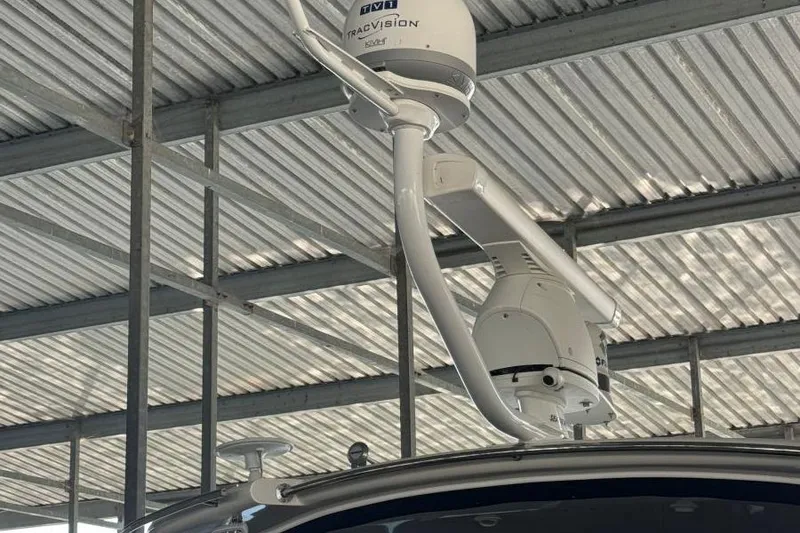 Slide: The Image of Satellite equipment on 2016 Regal 46 Sport Coupe under metal roof. - 50