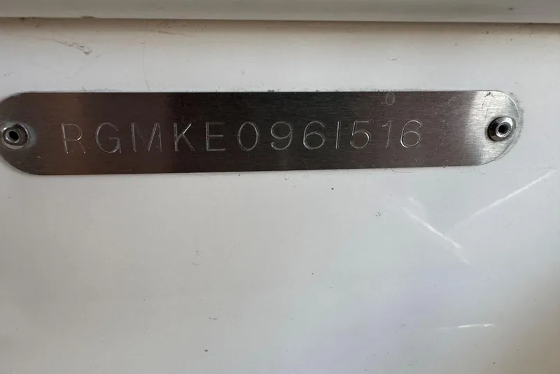 Slide: The Image of Metallic identification plate on a 2016 Regal 46 Sport Coupe boat. - 51