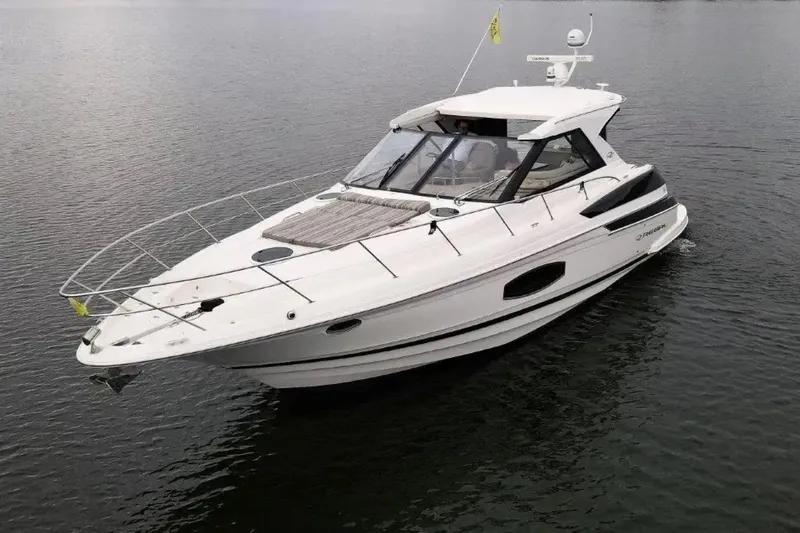 Slide: The Image of 2016 Regal 46 Sport Coupe yacht cruising on calm waters. - 52