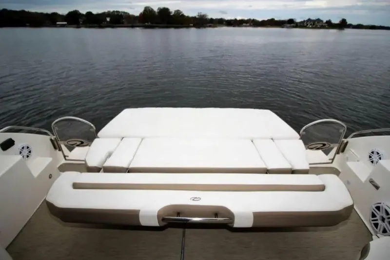 Slide: The Image of 2016 Regal 46 Sport Coupe yacht with spacious rear deck overlooking calm waters. - 53