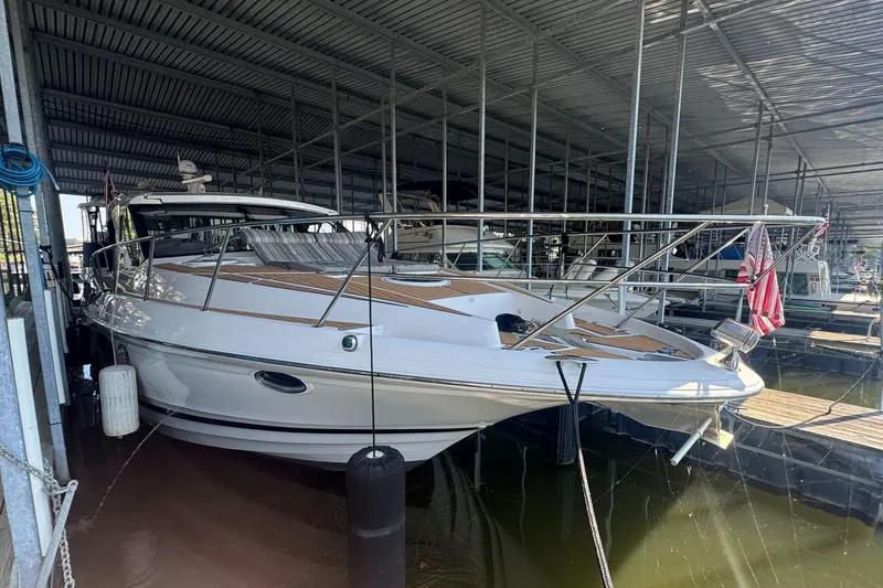 Slide: The Image of 2016 Regal 46 Sport Coupe yacht docked in covered marina. - 6