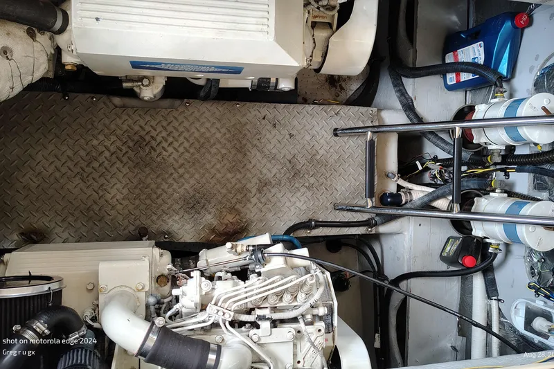 Slide: The Image of Engine compartment of a 2007 Meridian 341 Sedan with visible components and wiring. - 13