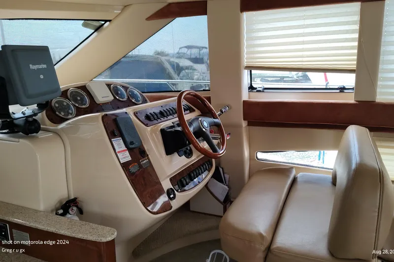 Slide: The Image of Interior of a 2007 Meridian 341 Sedan yacht with steering wheel and navigation equipment. - 2