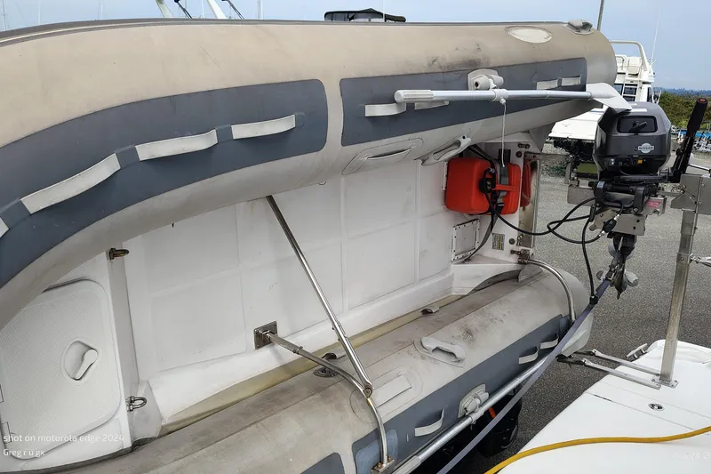 Slide: The Image of Inflatable boat with motor on a 2007 Meridian 341 Sedan yacht. - 9