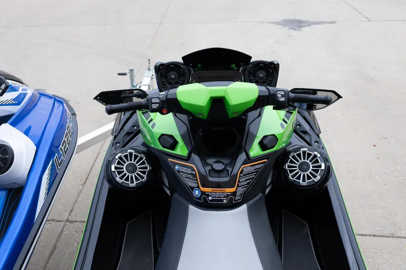 Slide: The Image of 2021 Yamaha WaveRunner GP1800R SVHO, green and black, top view of handlebars and controls. - 13