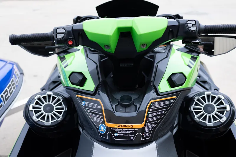 Slide: The Image of 2021 Yamaha WaveRunner GP1800R SVHO dashboard with green accents and speakers. - 15