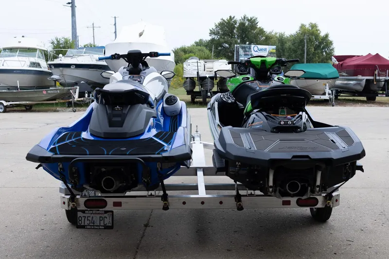 Slide: The Image of Two Yamaha WaveRunner GP1800R SVHO jet skis on a trailer, surrounded by boats. - 4