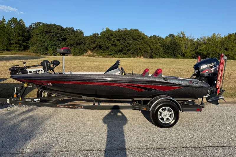 The Image of 2013 Ranger Z117 boat on trailer by the water, featuring Minn Kota motor. - 0