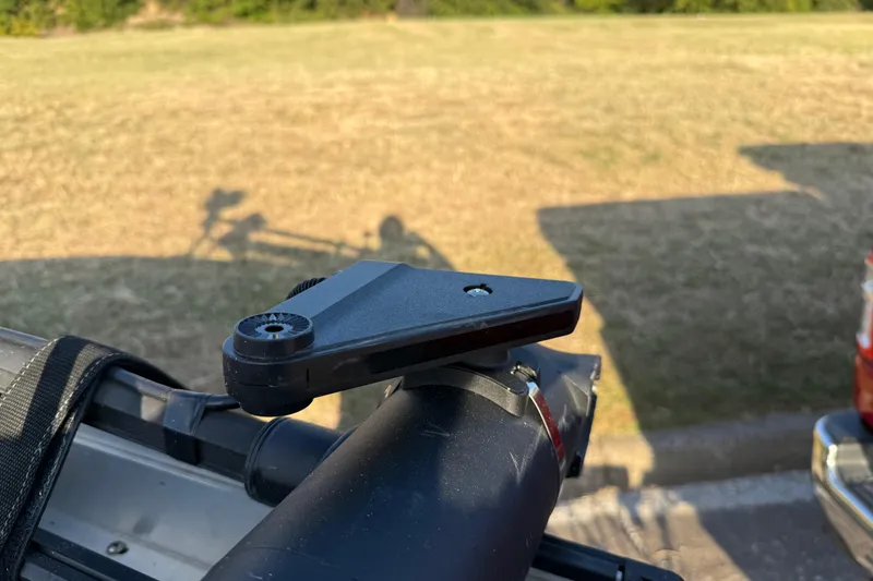 Slide: The Image of 2013 Ranger Z117 boat with metallic finish and red accents in a scenic outdoor setting. - 23