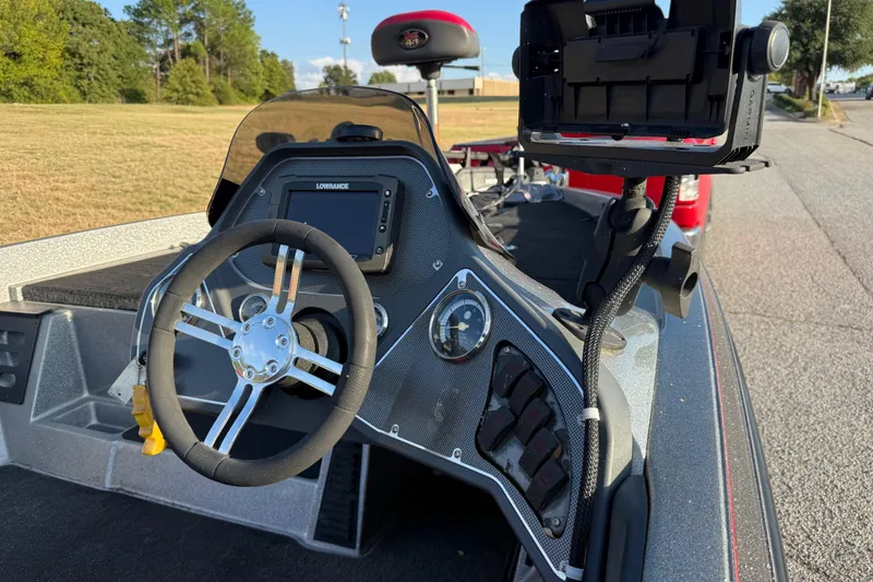 Slide: The Image of Close-up of Minn Kota trolling motor on 2013 Ranger Z117 boat, red truck in background. - 31
