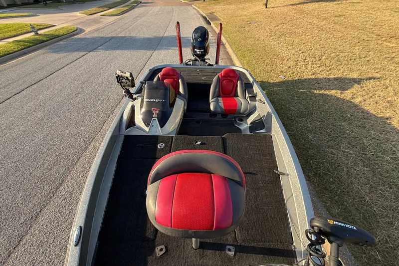 Slide: The Image of Rear view of a 2013 Ranger Z117 boat with a 115 horsepower engine. - 34