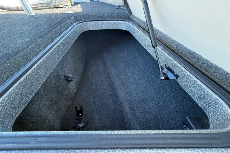 Slide: The Image of 2013 Ranger Z117 boat on trailer, close-up view of hull and wheel. - 37