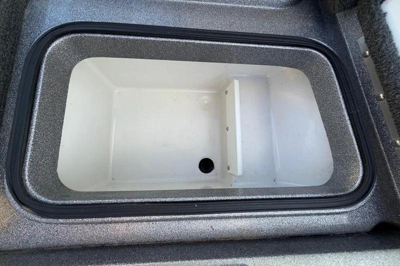 Slide: The Image of 2013 Ranger Z117 boat on trailer, red stripe, sunny day, close-up view. - 38