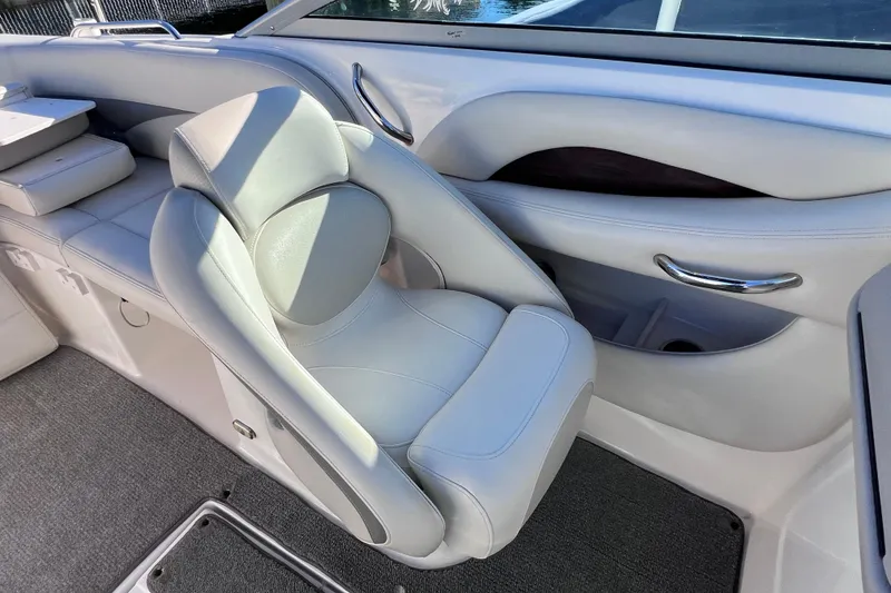 Slide: The Image of 2006 Chaparral 256 SSi boat interior with plush seating and sleek design. - 15