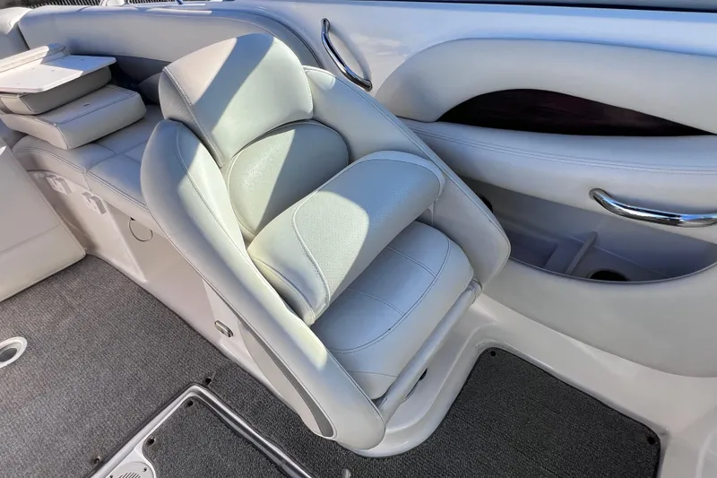 Slide: The Image of 2006 Chaparral 256 SSi boat interior with plush seating and sleek design. - 16