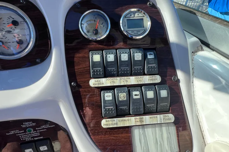 Slide: The Image of Control panel of a 2006 Chaparral 256 SSi boat with gauges and switches. - 22