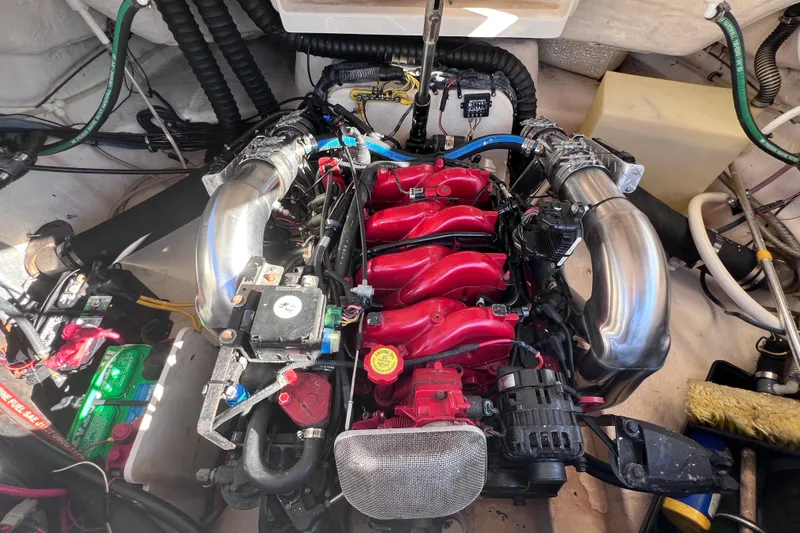 Slide: The Image of 2006 Chaparral 256 SSi engine compartment with red and silver components. - 40