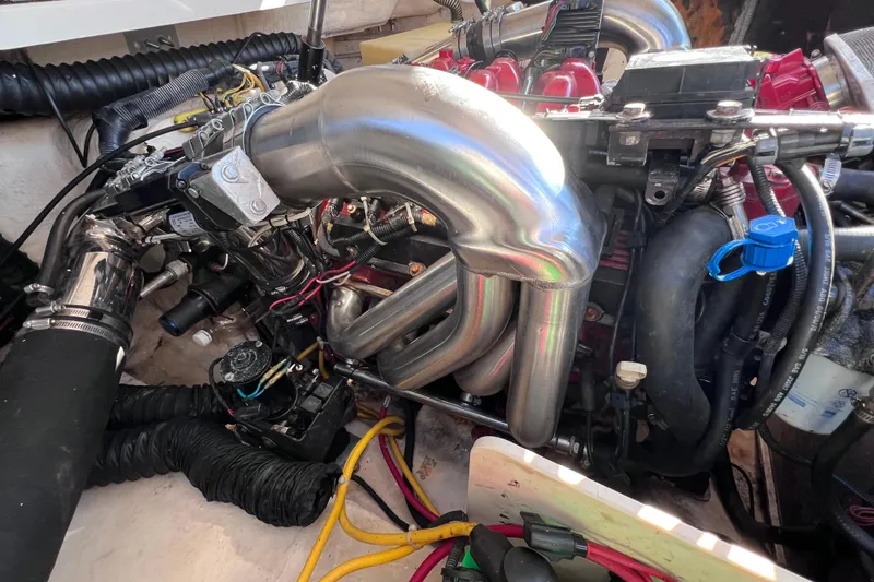 Slide: The Image of Engine compartment of a 2006 Chaparral 256 SSi boat, showcasing polished components. - 41