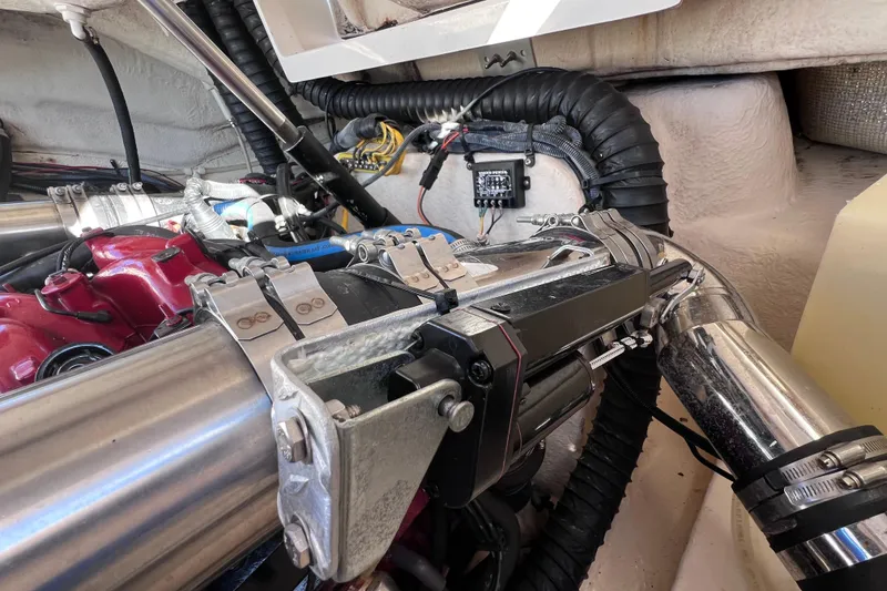 Slide: The Image of Engine compartment of a 2006 Chaparral 256 SSi boat, showcasing mechanical components. - 43