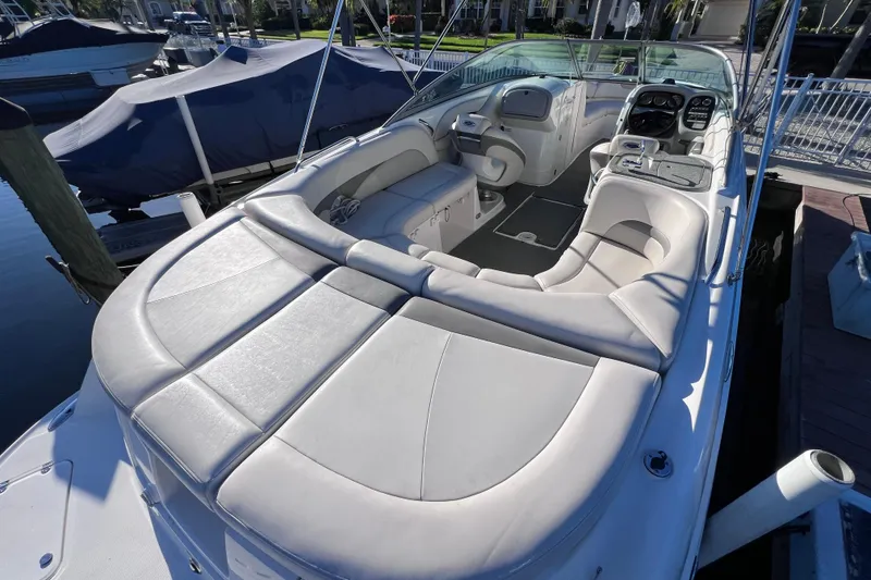 Slide: The Image of 2006 Chaparral 256 SSi boat interior with spacious seating and modern dashboard. - 8