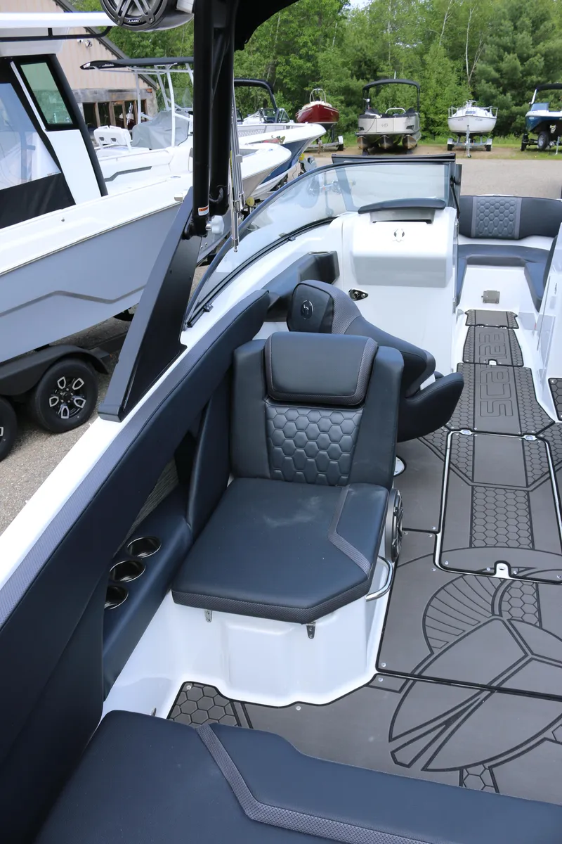 Slide: The Image of 2026 Scarab 255 LX boat interior with modern seating and sleek design. - 13