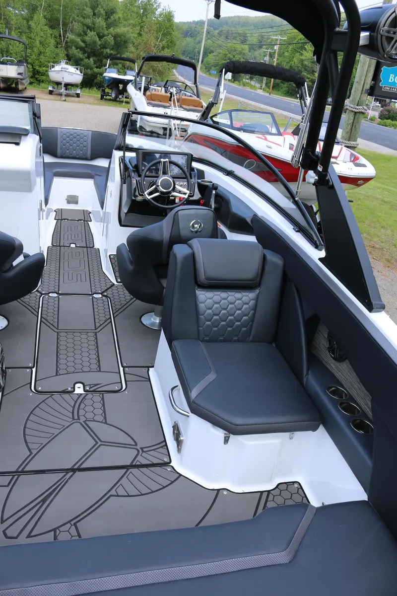 Slide: The Image of 2026 Scarab 255 LX boat interior with modern seating and sleek design. - 14