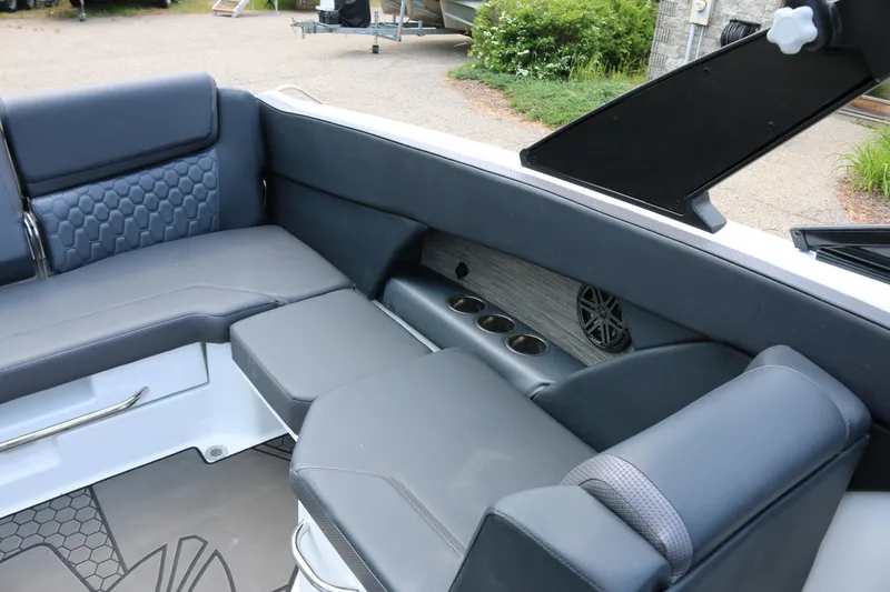 Slide: The Image of Luxurious interior of 2026 Scarab 255 LX boat with sleek seating and cup holders. - 18