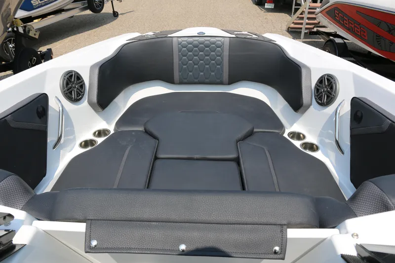 Slide: The Image of 2026 Scarab 255 LX boat interior with black seating and built-in speakers. - 28