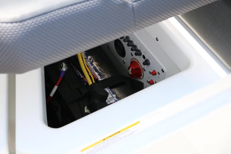 Slide: The Image of Electrical panel and battery compartment of 2026 Scarab 255 LX boat. - 31