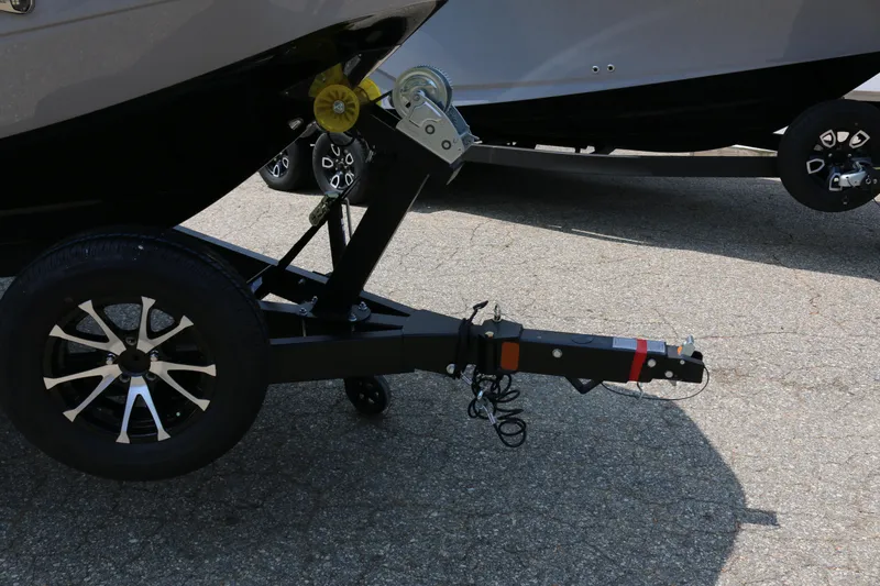 Slide: The Image of Trailer hitch of 2026 Scarab 255 LX boat on pavement. - 8