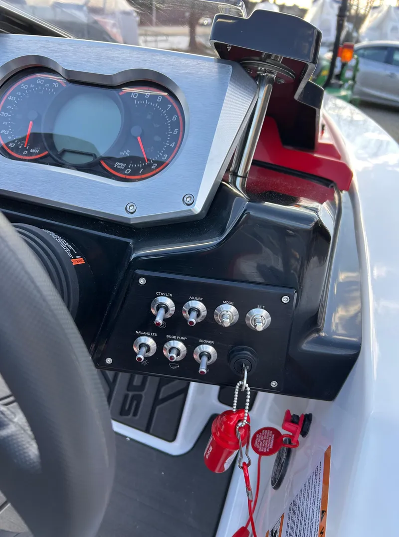 Slide: The Image of Dashboard of 2025 Scarab 165 LX boat with controls and gauges. - 18