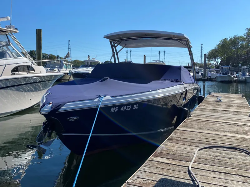 Slide: The Image of 2019 Cobalt R7 boat docked with cover, sunny day, marina setting. - 13