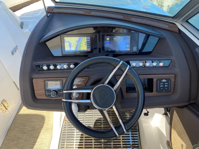Slide: The Image of 2019 Cobalt R7 boat dashboard with steering wheel and digital displays. - 7