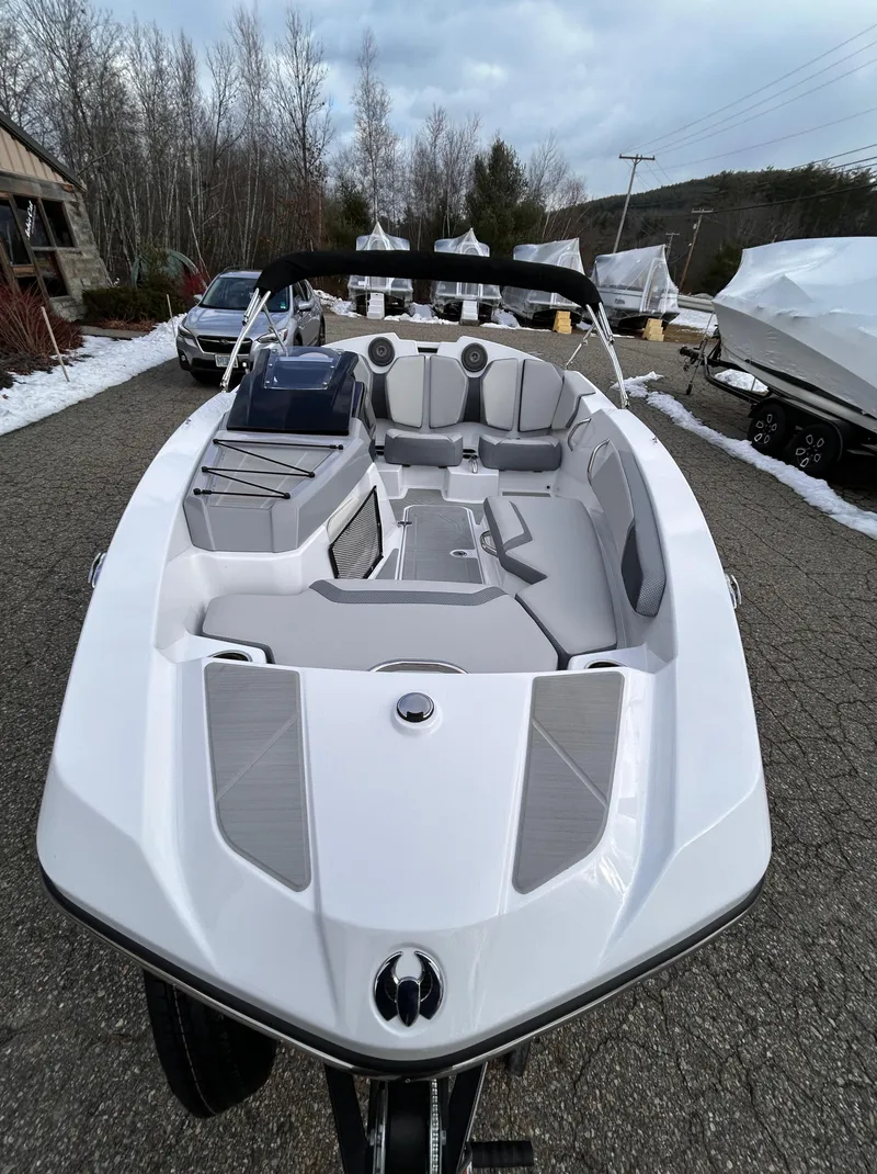 Slide: The Image of 2025 Scarab 165 SE boat interior with modern seating and built-in speakers. - 10