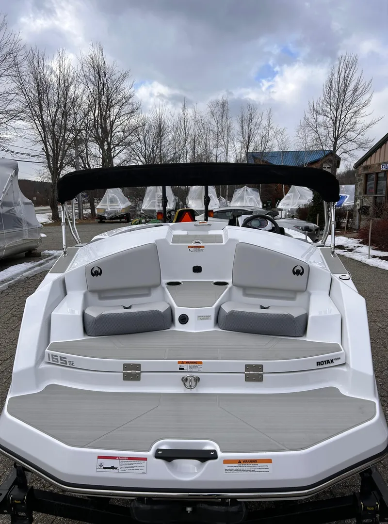 Slide: The Image of 2025 Scarab 165 SE boat interior with steering wheel and seating. - 11