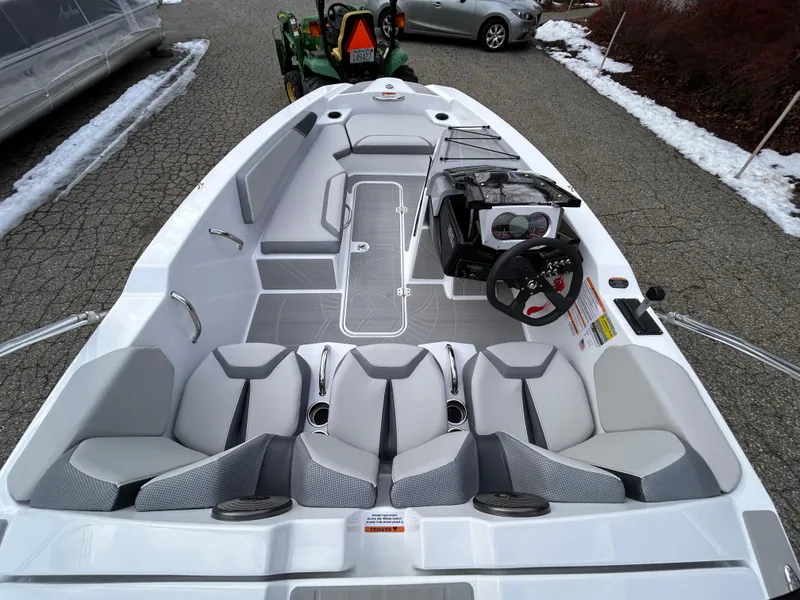 Slide: The Image of 2025 Scarab 165 SE dashboard with Kicker audio system and speedometer. - 14