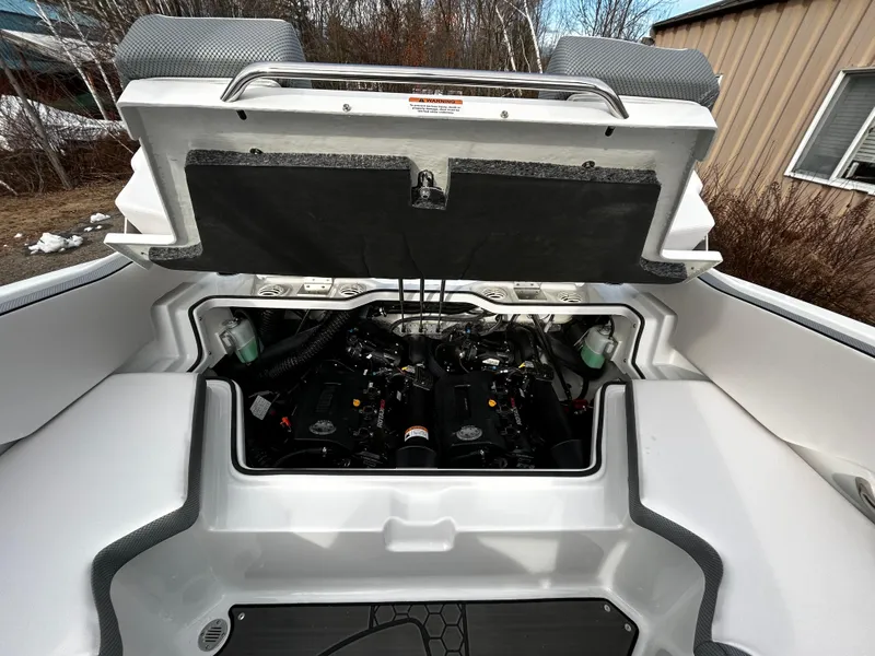 Slide: The Image of 2024 Scarab 215 Wake LE boat engine compartment with open hatch. - 10