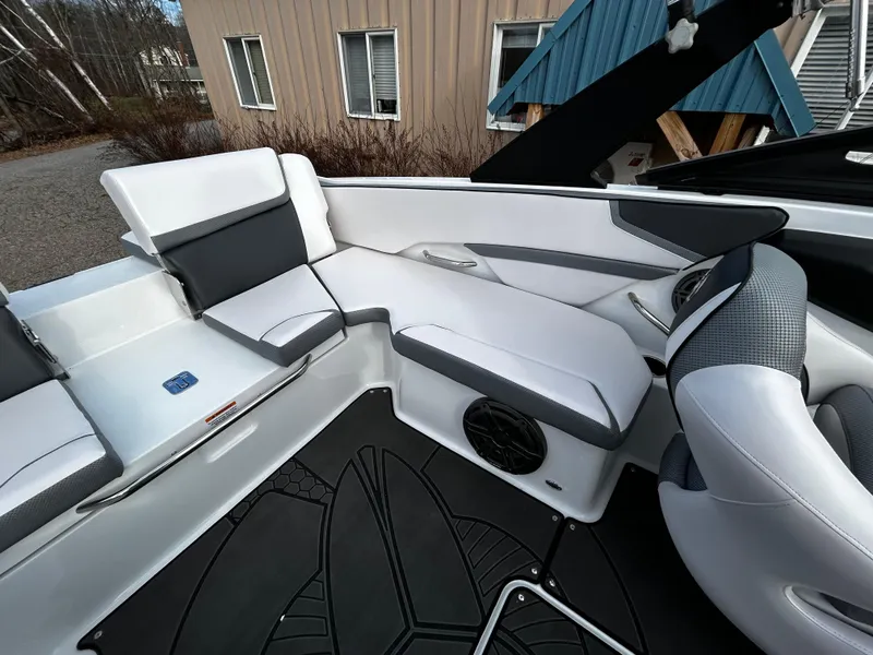 Slide: The Image of 2024 Scarab 215 Wake LE boat interior with white and gray seating. - 14