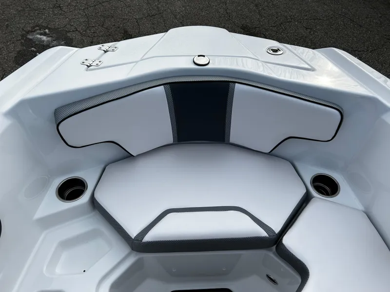 Slide: The Image of 2024 Scarab 215 Wake LE boat interior seating with cup holders. - 26