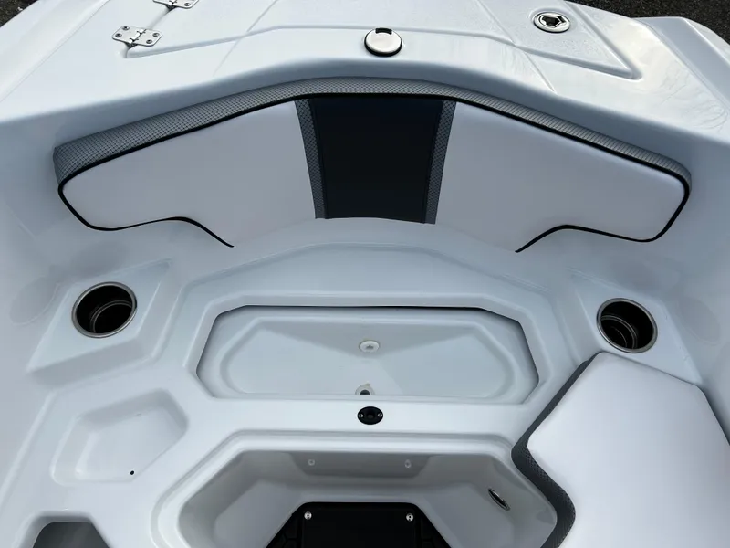 Slide: The Image of 2024 Scarab 215 Wake LE boat interior, white seating with cup holders. - 27
