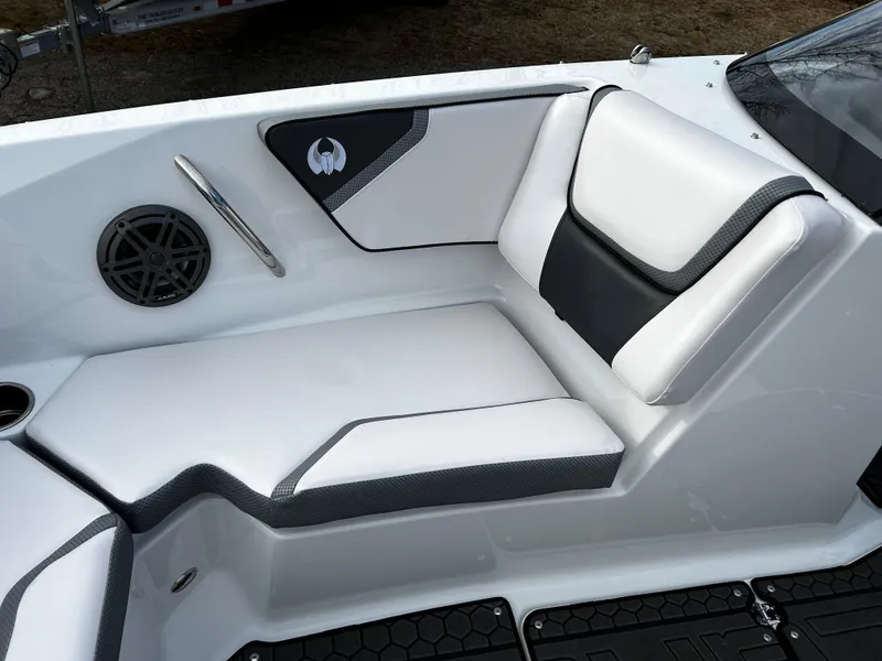 Slide: The Image of 2024 Scarab 215 Wake LE boat interior with white and black seating. - 28