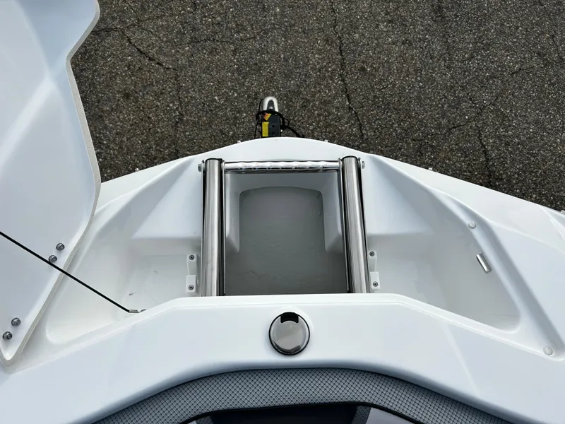 Slide: The Image of 2024 Scarab 215 Wake LE boat bow storage compartment with stainless steel ladder. - 31