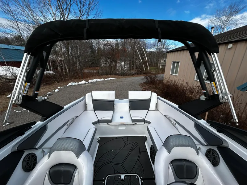 Slide: The Image of 2024 Scarab 215 Wake LE boat interior with seating and wakeboard tower. - 33