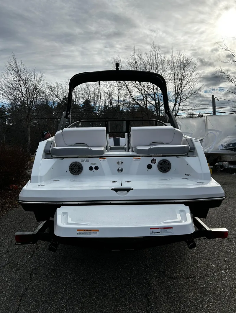 Slide: The Image of 2024 Scarab 215 Wake LE boat rear view on a cloudy day. - 43