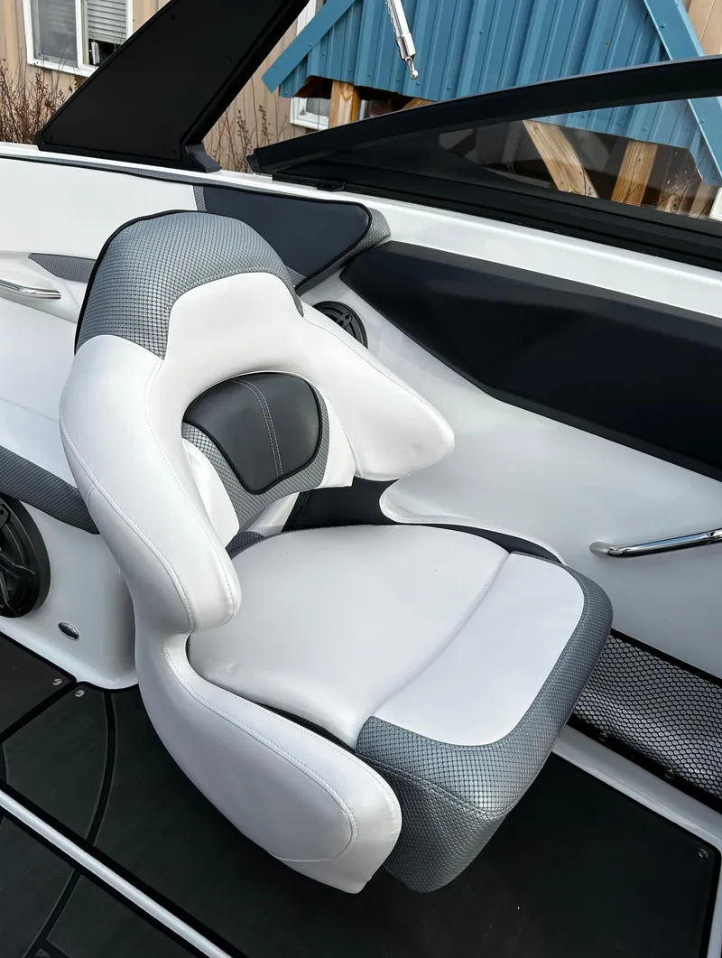 Slide: The Image of 2024 Scarab 215 Wake LE boat seat with white and gray upholstery. - 50