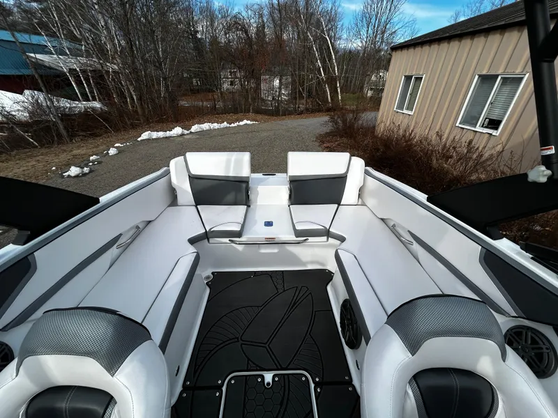 Slide: The Image of 2024 Scarab 215 Wake LE boat interior with white and gray seating. - 9