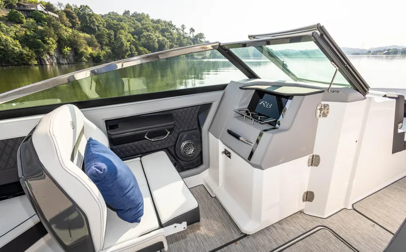 Slide: The Image of Interior of 2023 Cobalt R33 boat with luxurious seating and modern dashboard. - 17